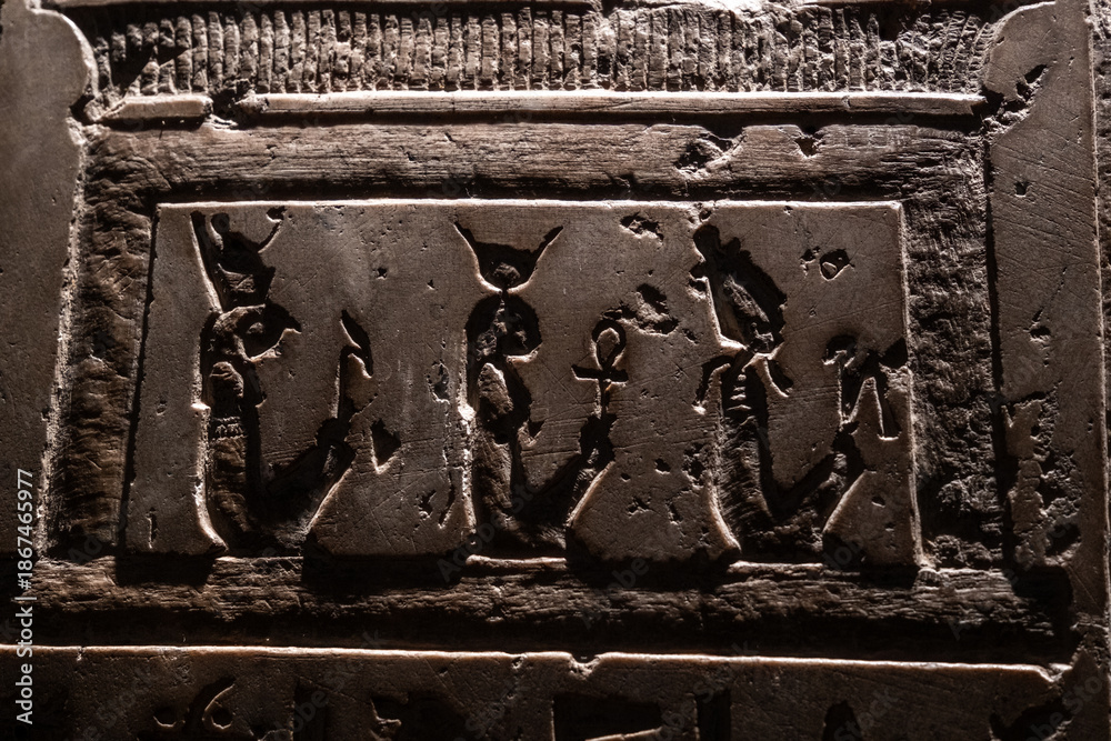 Ancient Egyption Ramp Inscription Ancient Egyptian hieroglyphs carved on stone. The inscriptions display ...