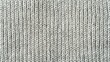 © Image World - Detailed view of an off-white textured ribbed knit fabric surface