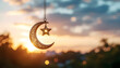 © hibiniu - A soft-focus cinematic Ramadan scene featuring a hanging crescent moon and star ornament