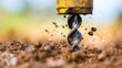© tashechka - Drill creates holes in soil at a construction site during daytime