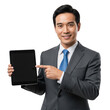 © Al - Smiling asian businessman in suit pointing to blank tablet screen isolated on transparent background