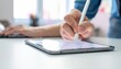 © Rahmat  - Creative person hand holding a digital pencil stylus drawing or sketching on a tablet device screen generating new design concepts in the office space to text. copy text.