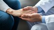 © Alena - Close up of doctor and patient hands during preventive health consultation, showcasing compassion and care in a medical environment with soft lighting.