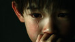 © bephoto - 涙を流し物思いに沈む男の子、切ない表情の一瞬