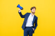 © VISTA by Westend61 - Businessman with megaphone gestures on yellow background