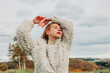 © VISTA by Westend61 - Fashionable person in white sheep wool jacket posing outdoors in autumn