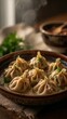 © Ali Adel Mohsen - Steaming hot Georgian khinkali dumplings served in a rustic bowl and garnished with fresh herbs