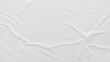 © Firman - White crumpled and creased paper poster texture background. Abstract white paper background. Crumpled paper poster with soft creased surface texture.
