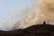 © Colin Ward - Man using a Drip Torch for controlled burning of Heather on moorland in County Durham, England, UK.