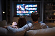 © Photoenthusiast82 - Couple watching a streaming movie on a couch at home, streaming provider, streaming services