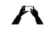 © Rita - Hands holding a smartphone taking a photo or video dark outline silhouette