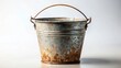 © Collection - A weathered metal pail with a rusty patina and a simple wire handle, showing signs of age and use, sits on a neutral background