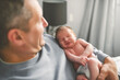© Louis-Paul Photo - Father with his cute newborn baby indoors