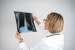 © Nenad - Female doctor examining a lung radiography