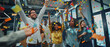 © petrrgoskov - Diverse group of young professionals celebrating success with confetti in a modern office. Team achievement, startup culture, motivation, teamwork and positive work environment.