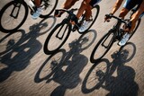 Cyclists Racing In Motion On Urban Road.
Close up view of cyclists legs and wheels during a road race, capturing speed, teamwork and athletic energy on asphalt in a dynamic competitive cycling scene.