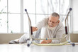 © Pixel-Shot - Senior man with walker lying on floor after fall at home