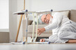 © Pixel-Shot - Senior man with walker lying on floor after fall at home