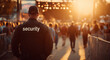 © © Ai Factory - Security guard in black uniform watching over a crowd at an outdoor music festival during sunset, public safety and event management for concert security and crowd control