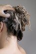 © Asya Molochkova/Stocksy - Unrecognizable Woman Washing Hair with Foam Close-Up