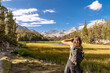 © Christine La/Stocksy - hike taking photograph scenic view