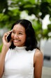 © Maia Images/Stocksy - Happy Woman Talking on Phone Outdoors and Smiling