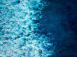 © C6 Studio/Stocksy - Top down aerial view of tropical blue ocean wave