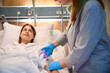 © Svitlana - Female patient receiving injection from nurse in hospital