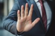 © nsit0108 - Businessman showing a stop hand gesture, signaling refusal, rejection, or prohibition