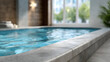 © Edhar - Indoor swimming pool with blue water and large windows luxury spa and fitness club interior