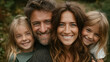 © Edhar - happy family with two children hugging in green forest nature parenting love togetherness and outdoor weekend lifestyle
