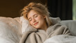 © Edhar - Young woman resting in soft blanket on bed peaceful daytime nap cozy home relaxation and self care