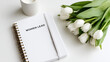 © Olha Havelia - Detailed shot of a minimalist workspace with a 'Women Lead' notebook and a small vase of tulips, International Women's Day professional aesthetic, bright clean lighting, sharp focu
