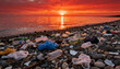 © tilialucida - Polluted beach with plastic waste and debris at sunset highlighting environmental pollution issues
