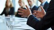 © TensorSpark - Business leader gesturing during boardroom coaching session with executive team around table, symbolizing leadership development and strategic guidance.