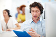 © peopleimages.com - Call center, talk and businessman with document for customer service, help desk and inbound support. Headset, paperwork and mature consultant with communication for advice, crm feedback or coworking