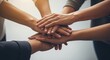 © Farhan - Close Up of Diverse Team Hands Stacked Together Symbolizing Unity and Professional Cooperation