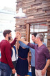 © peopleimages.com - Support, teamwork and high five with business people in meeting for campaign advisor, success and mission. Brand consultant, solidarity and collaboration with employees hands together in agency