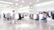 © CuteBee - A blurred view of a brightly lit retail space featuring clothing racks and indistinct figures of shoppers browsing merchandise within the store
