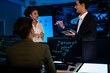 © ultramansk - Industrial design team planning future transport strategy. Executive presenting new smart mobility concept and market trend analysis on digital board during late night workshop.