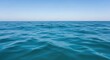 © SOEM - A vast expanse of calm, blue ocean with gentle waves and a clear, blue sky in the background.