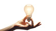 © MDAbdul - Business idea concept hand holding glowing light bulb isolated on transparent background