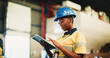 © BuyOutFelix06/peopleimages.com - Tablet, industry and black woman in warehouse with email for cargo information with supply chain. Digital technology, export and African logistics manager with online inventory for stock delivery.