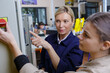 © auremar - young woman learning from senior factory worker