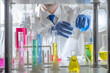 © TSViPhoto - working in a modern laboratory, carefully analyzing chemical samples among glass flasks, test tubes. Concept of professional research, chemistry expertise, scientific methodology laboratory science.