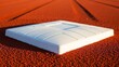 © ira - Baseball base on a red dirt field under natural light.
