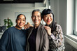 © Marko Geber - Adult and mature coworkers smiling happily in a modern office