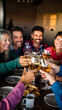 © jambulart - Group of friends celebrating with wine at a cozy indoor gathering.