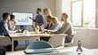 © Konate - Diverse team in office meeting, presenting financial graph on screen, with a grey awareness ribbon in foreground.