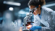 © Jhati - A scientist in a lab coat examining a sample under a microscope
